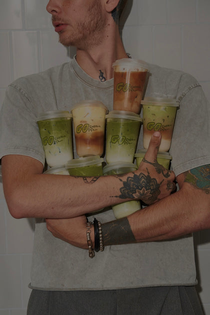 A barista at the espresso machine