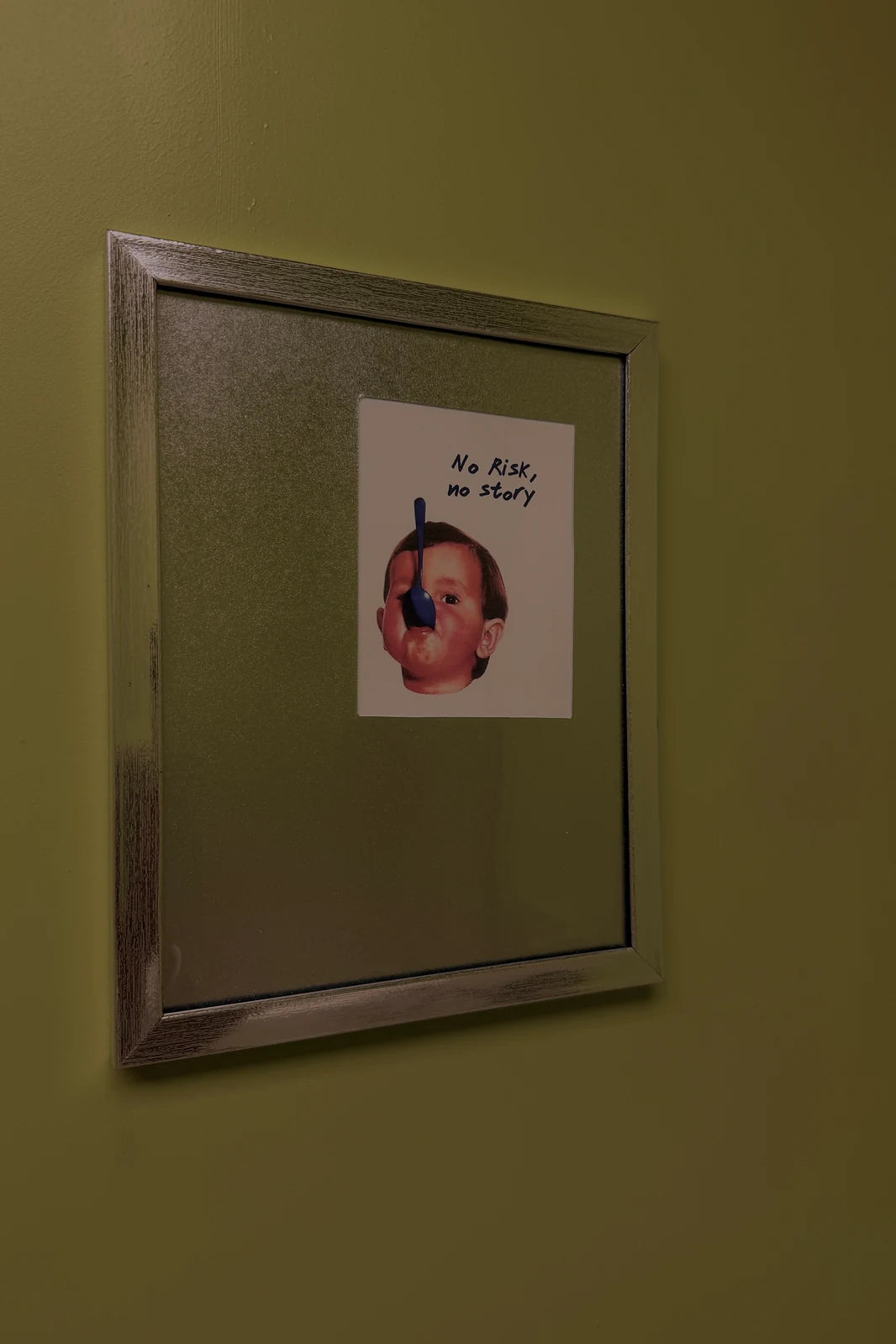 A framed print on the cafe wall reading No Risk no story